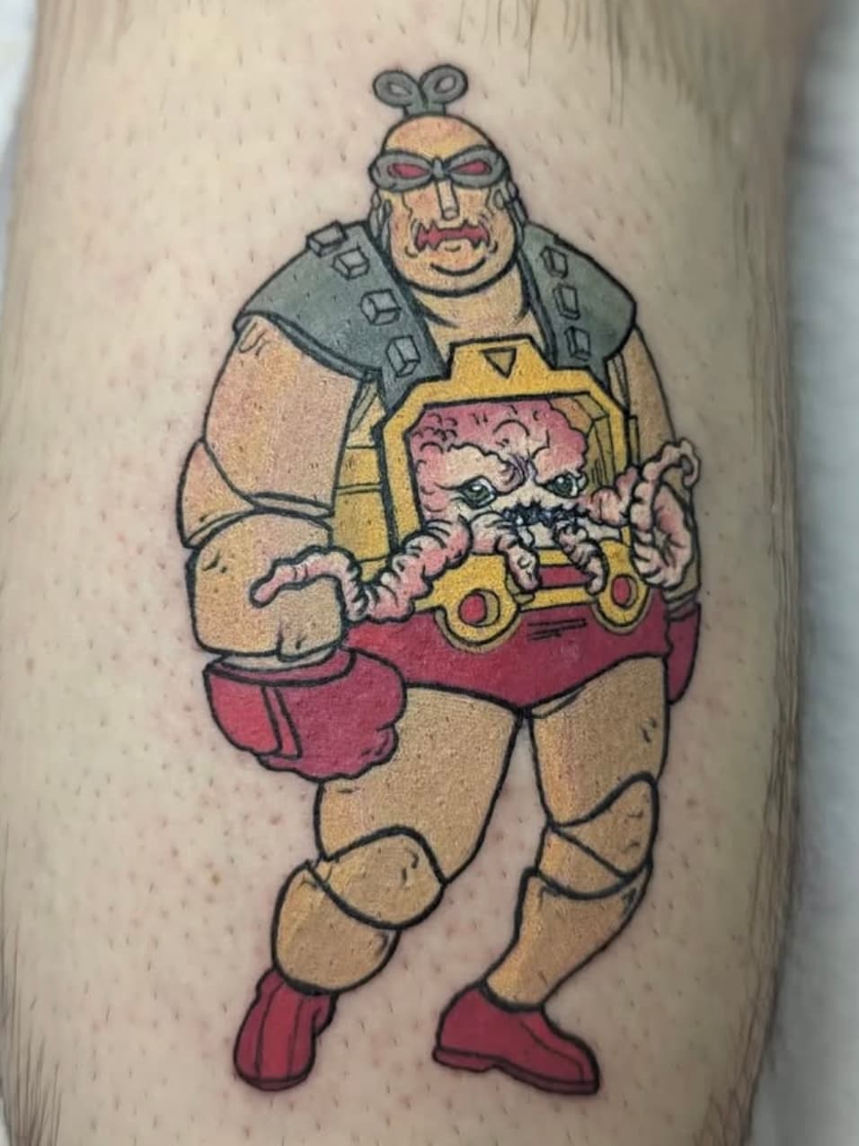 Tattoo of Krang character from Teenage Mutant Ninja Turtles on leg